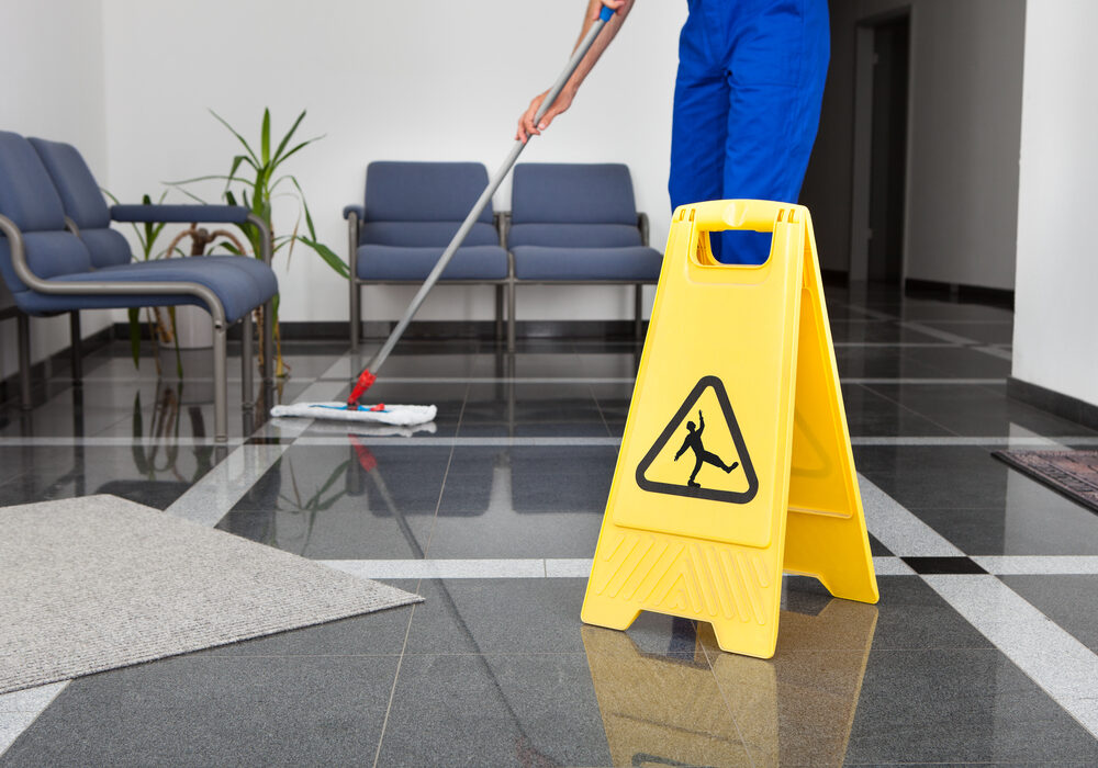 Close-up,Of,Man,Cleaning,The,Floor,With,Yellow,Wet,Floor