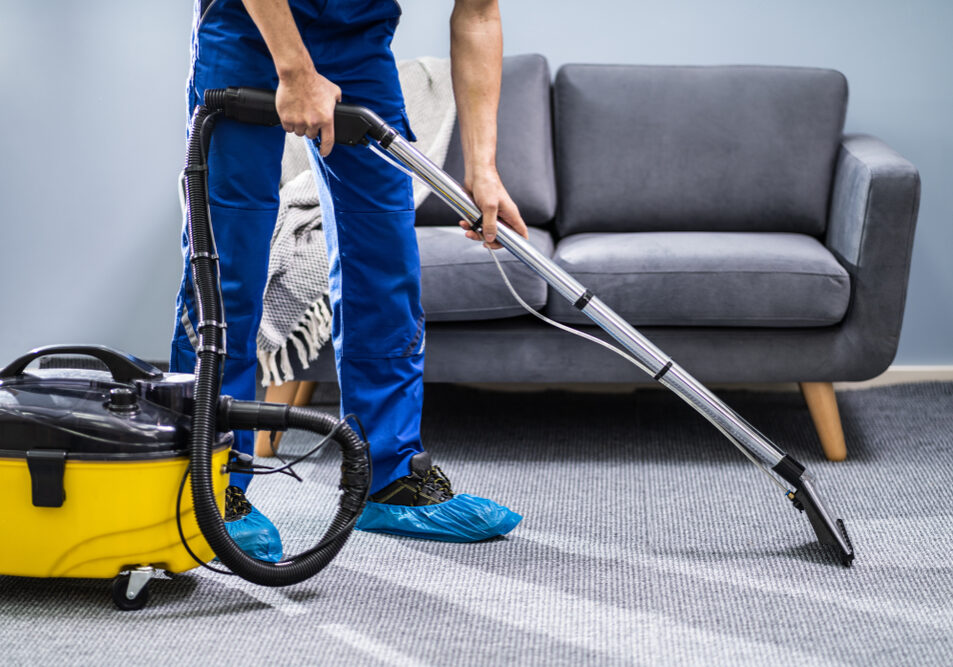 Photo,Of,Janitor,Cleaning,Carpet,With,Vacuum,Cleaner