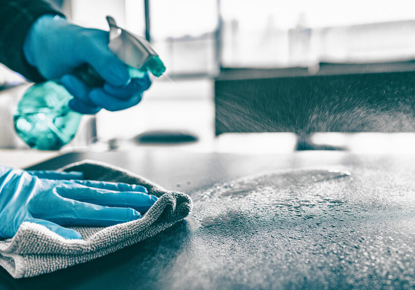 Cleaning,Home,Table,Sanitizing,Kitchen,Table,Surface,With,Disinfectant,Spray