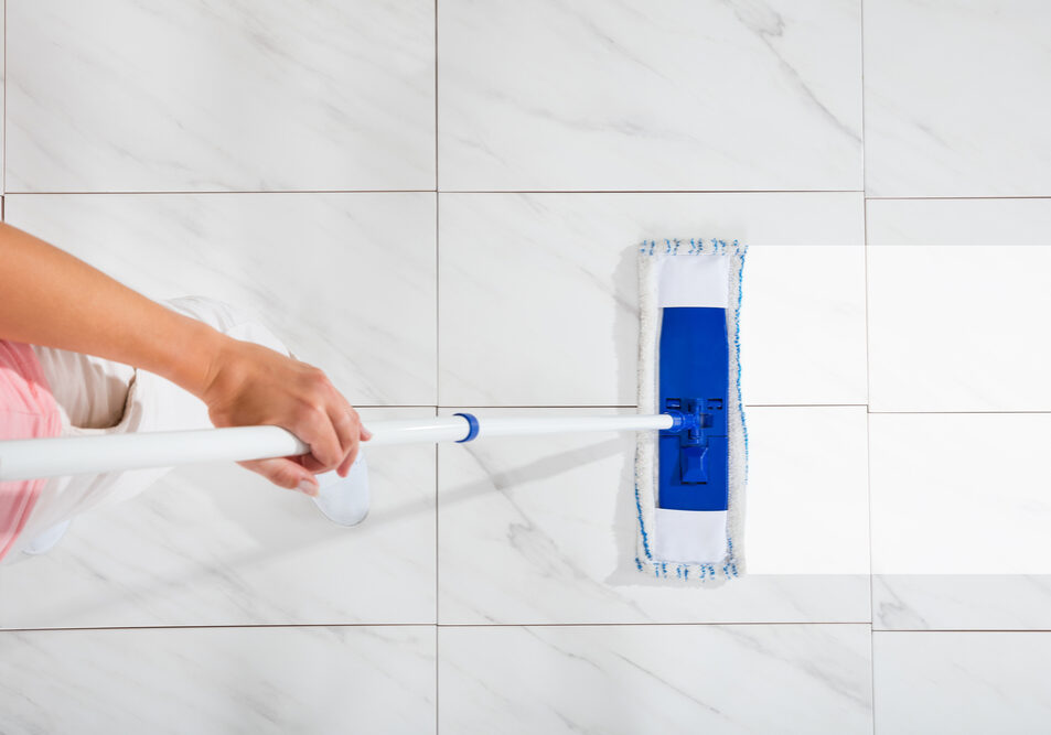 High,Angle,View,Of,Person,Cleaning,Floor,With,Mop